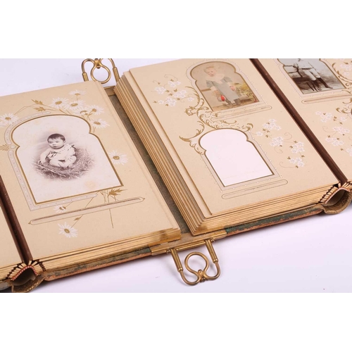 419 - A 19th-century Continental tooled leather bound double photograph album, the cover painted with a Da... 