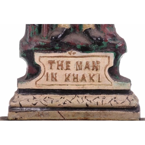 428 - A cast iron stick and umbrella stand, 'The Man in Khaki', 20th century, painted in polychrome enamel... 