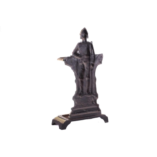 428 - A cast iron stick and umbrella stand, 'The Man in Khaki', 20th century, painted in polychrome enamel... 