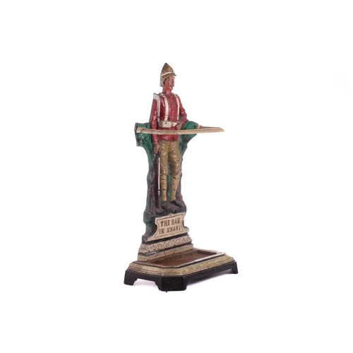 428 - A cast iron stick and umbrella stand, 'The Man in Khaki', 20th century, painted in polychrome enamel... 