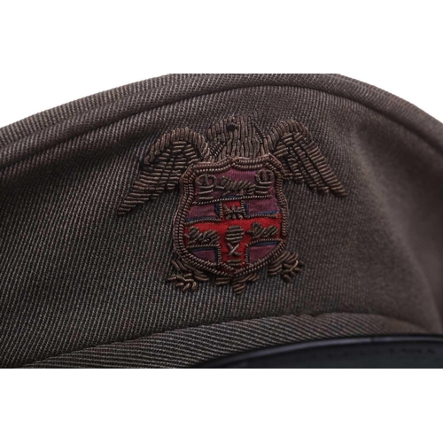 429 - The Savoy Hotel: a mid-20th century doorman's cap, canvas with leather lined interior, embroidered t... 