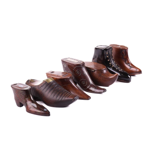 432 - A good collection of late 18th and 19th century treen snuff boxes, in the form of boots and shoes, i... 