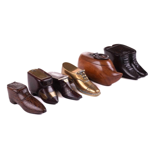 432 - A good collection of late 18th and 19th century treen snuff boxes, in the form of boots and shoes, i... 