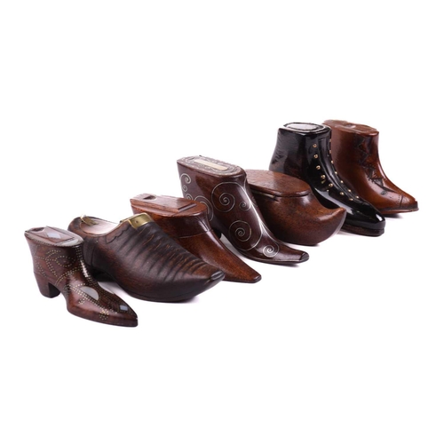 432 - A good collection of late 18th and 19th century treen snuff boxes, in the form of boots and shoes, i... 