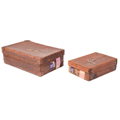 434 - A near pair of crocodile skin type leather suitcases, early 20th century, one with fitted interior, ... 