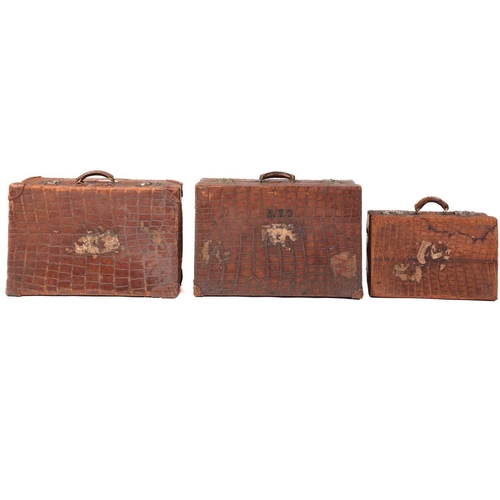 434 - A near pair of crocodile skin type leather suitcases, early 20th century, one with fitted interior, ... 