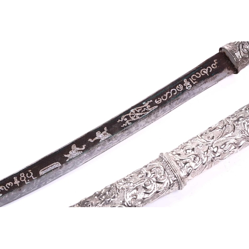 454 - A Thai white metal-mounted short sword with niello worked curving blade the hilt and scabbard of ova... 