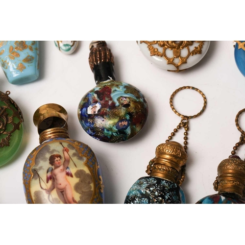 469 - A good collection of miniature Continental ceramic and Murano glass scent bottles, many with gilt mo... 