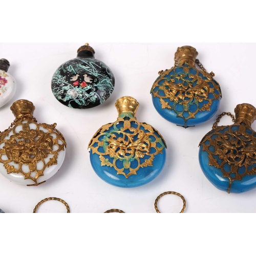 469 - A good collection of miniature Continental ceramic and Murano glass scent bottles, many with gilt mo... 