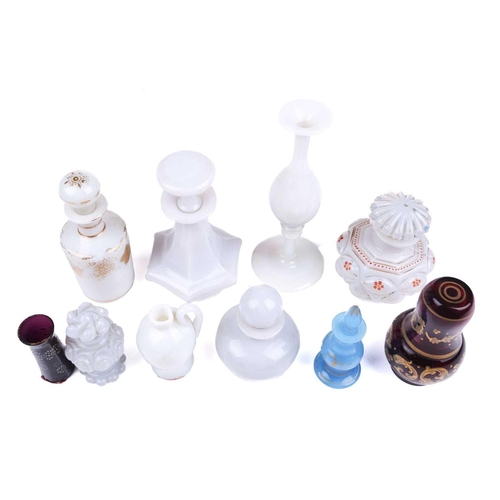 470 - A small collection of Victorian Vaseline glass perfume bottles and stoppers including an octagonal s... 