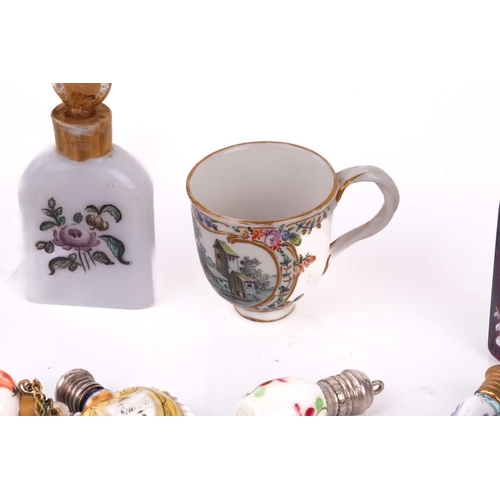 472 - A collection of miniature porcelain and glass scent bottles and containers, to include two modelled ... 