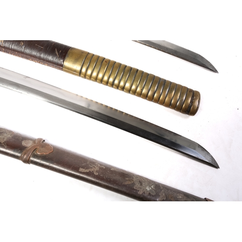 460A - A Japanese wakizashi, probably Meiji 19th/20th century with copper annulated tsuka and saya with a s... 