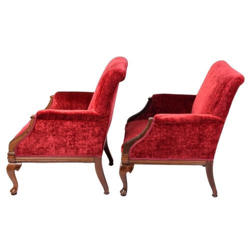 126 - A pair of 19th-century-style scroll-backed fireside armchairs with crimson velvet stuff over upholst... 