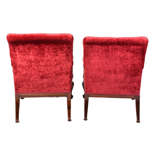 126 - A pair of 19th-century-style scroll-backed fireside armchairs with crimson velvet stuff over upholst... 