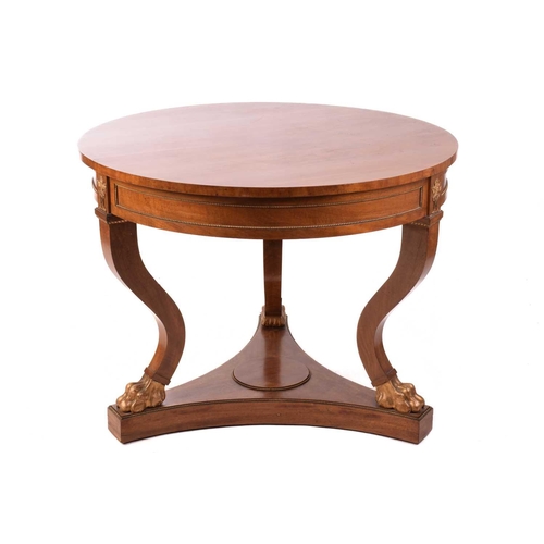 130 - A French Empire Style centre table, the circular top over a gilt beaded panelled frieze and flaming ... 
