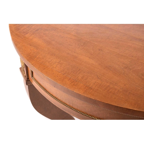 130 - A French Empire Style centre table, the circular top over a gilt beaded panelled frieze and flaming ... 