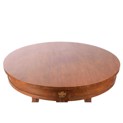 130 - A French Empire Style centre table, the circular top over a gilt beaded panelled frieze and flaming ... 