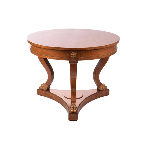 130 - A French Empire Style centre table, the circular top over a gilt beaded panelled frieze and flaming ... 