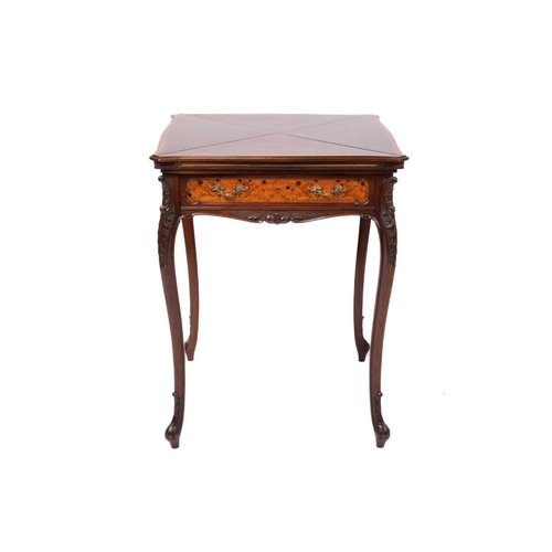 135 - A late Victorian mahogany envelope card table, the shaped square top with satinwood crossbanding ove... 