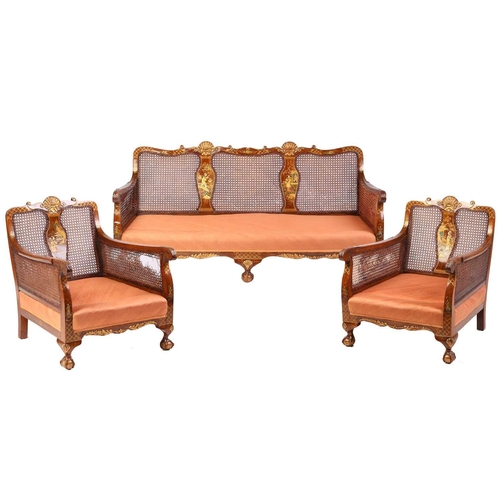 136 - An early 20th-century walnut and chinoiserie lacquer three-piece bergere lounge suite, probably 1920... 