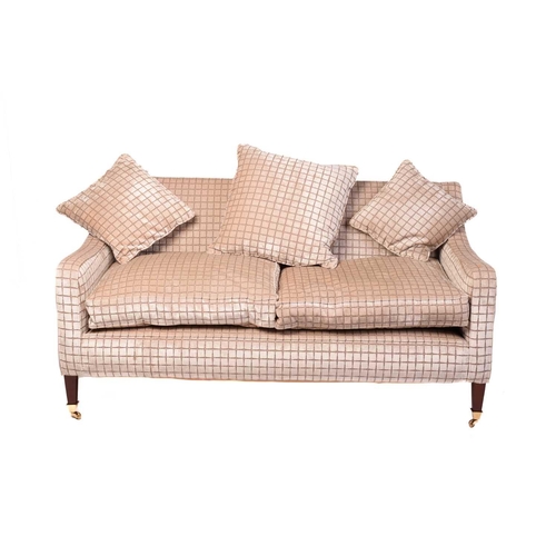 142 - A Regency style settee, 20th century, well upholstered in a square grid pattern material, on square ... 