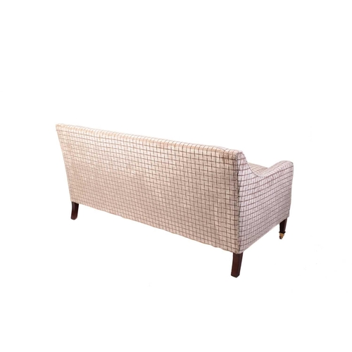 142 - A Regency style settee, 20th century, well upholstered in a square grid pattern material, on square ... 