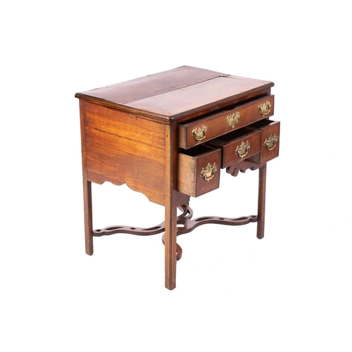 143 - A George III mahogany kneehole lowboy with cross and feather banded top above a single frieze drawer... 