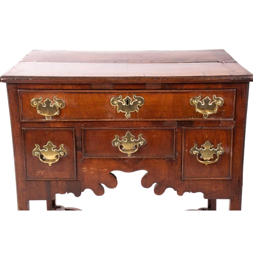 143 - A George III mahogany kneehole lowboy with cross and feather banded top above a single frieze drawer... 