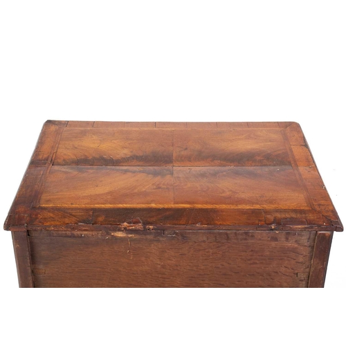143 - A George III mahogany kneehole lowboy with cross and feather banded top above a single frieze drawer... 