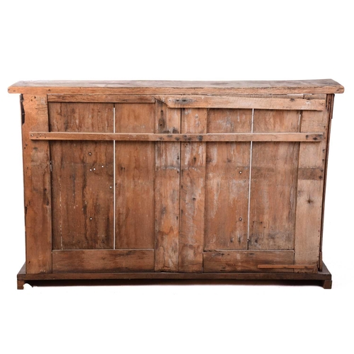 146 - A carved oak choir front, parts possibly 18th century French, the later top over panelled backs and ... 