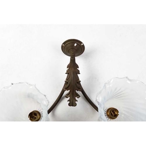 147 - Four sets of late 19th-century French-style brass wall sconces, twin branch with leaf decoration, th... 