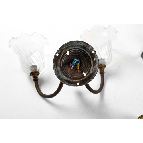 147 - Four sets of late 19th-century French-style brass wall sconces, twin branch with leaf decoration, th... 