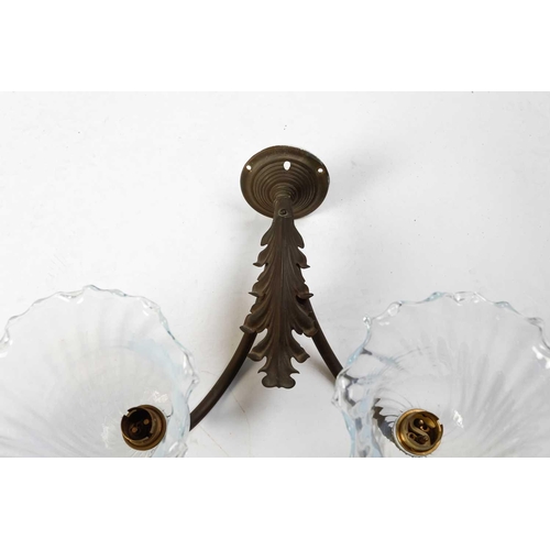 147 - Four sets of late 19th-century French-style brass wall sconces, twin branch with leaf decoration, th... 