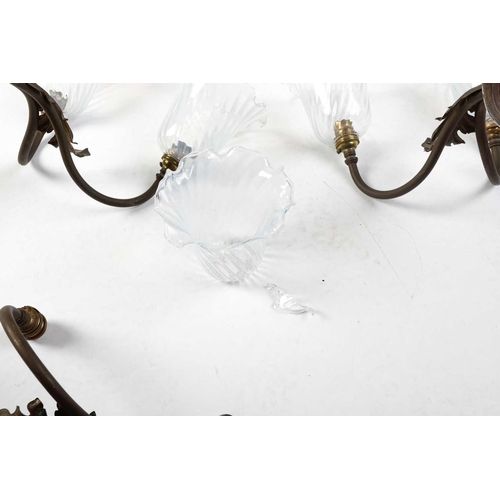 147 - Four sets of late 19th-century French-style brass wall sconces, twin branch with leaf decoration, th... 