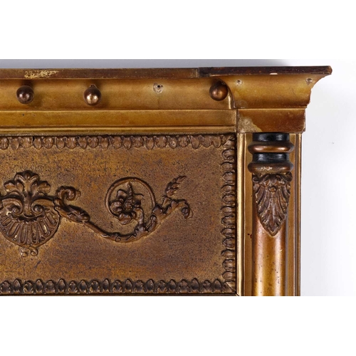 150 - A Regency carved wood and gilt gesso pier glass, the inverted breakfront frame with sphere set corni... 