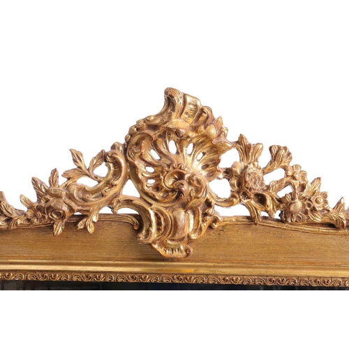 151 - A 19th-century moulded and gilt plaster mirror with bevelled glass, the crest with a bird amongst ro... 