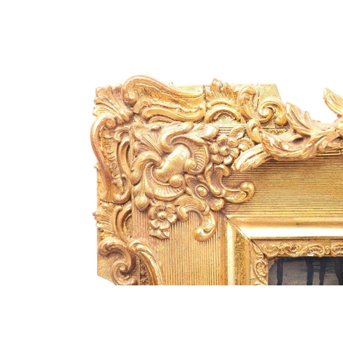 151 - A 19th-century moulded and gilt plaster mirror with bevelled glass, the crest with a bird amongst ro... 