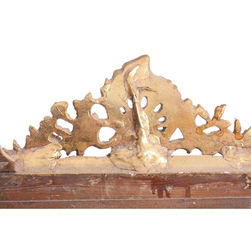 151 - A 19th-century moulded and gilt plaster mirror with bevelled glass, the crest with a bird amongst ro... 