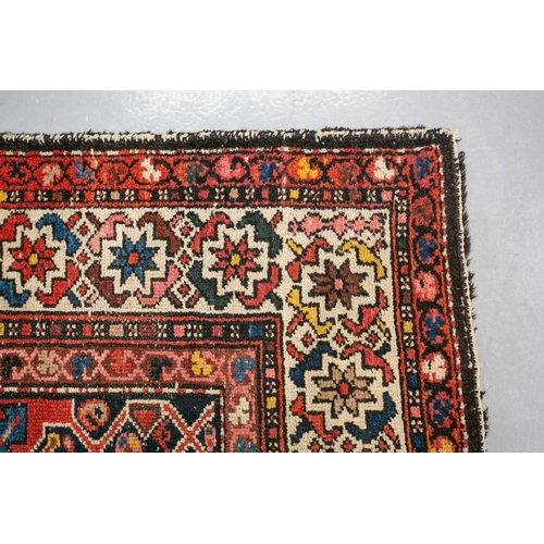 152 - An antique Hammadan runner with a central star lozenge pole on a blue ground within multiple borders... 
