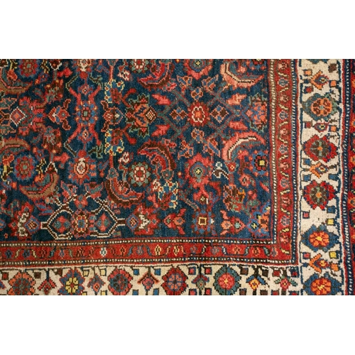 153 - A long antique Bidjar runner with Herat motif on a dark blue ground within multiple borders, 5.5 mtr... 