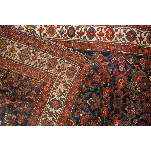 153 - A long antique Bidjar runner with Herat motif on a dark blue ground within multiple borders, 5.5 mtr... 