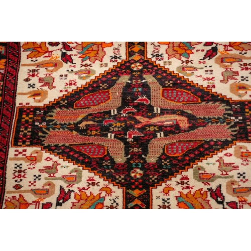 154 - An Afshar bag face with chickens and figures on an ivory ground, 70 cm x 67 cm, and a Turkoman mat a... 
