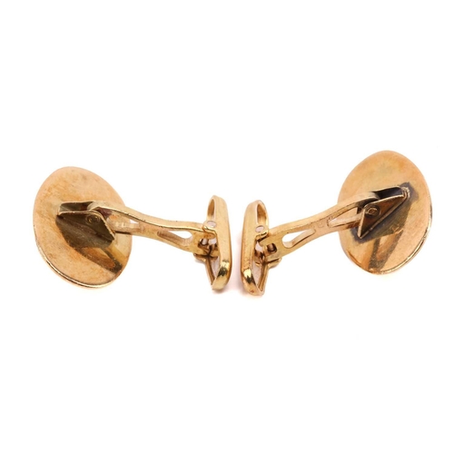 12 - A pair of emerald cufflinks, each set with an oval cabochon emerald, with Italian control marks mark... 