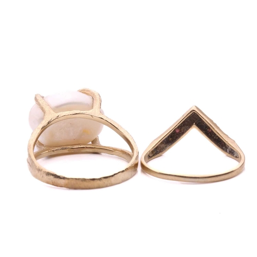 123 - A pearl ring and a gem-set wishbone ring; the pearl ring features a button-shaped cultured pearl of ... 