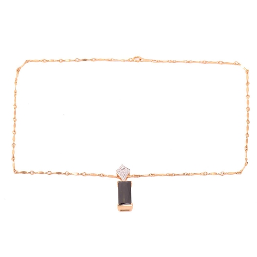 124 - A tourmaline and diamond ring and similar pendant on chain; the ring features an elongated baguette-... 