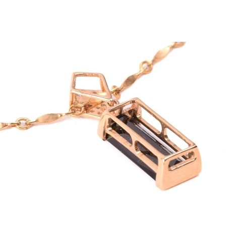 124 - A tourmaline and diamond ring and similar pendant on chain; the ring features an elongated baguette-... 