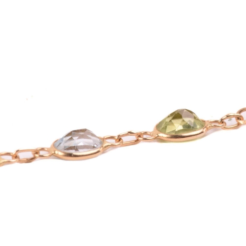 125 - A gem-set harlequin necklace, open-back links set with oval-cut gemstones of 4.0 mm, alternating wit... 