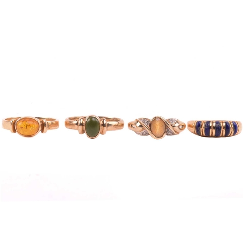 126 - A lapis five stone ring, set with a row of cabochon lapis lazuli, with egyptian hallmarks for 18ct g... 