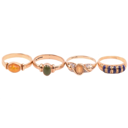 126 - A lapis five stone ring, set with a row of cabochon lapis lazuli, with egyptian hallmarks for 18ct g... 
