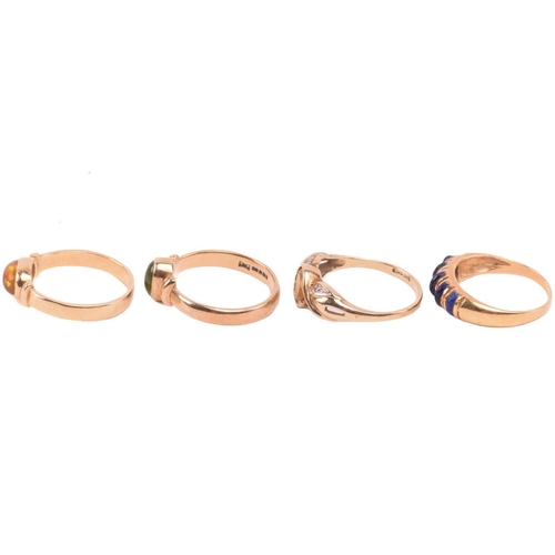 126 - A lapis five stone ring, set with a row of cabochon lapis lazuli, with egyptian hallmarks for 18ct g... 